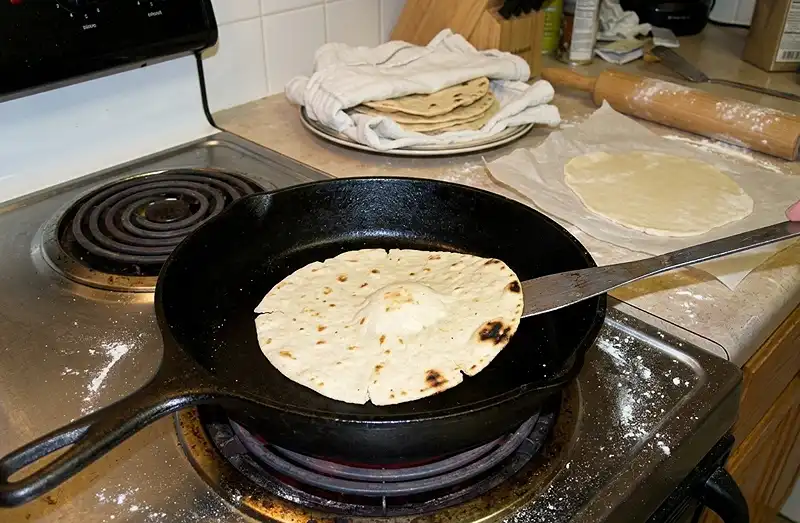 over the dry cast‑iron skillet